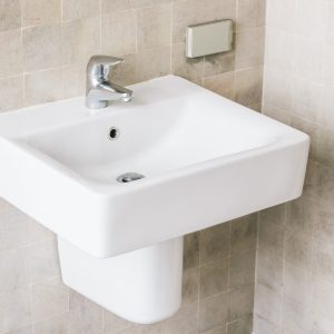 White sink and faucet White sink and faucet decoration in bathroom interior